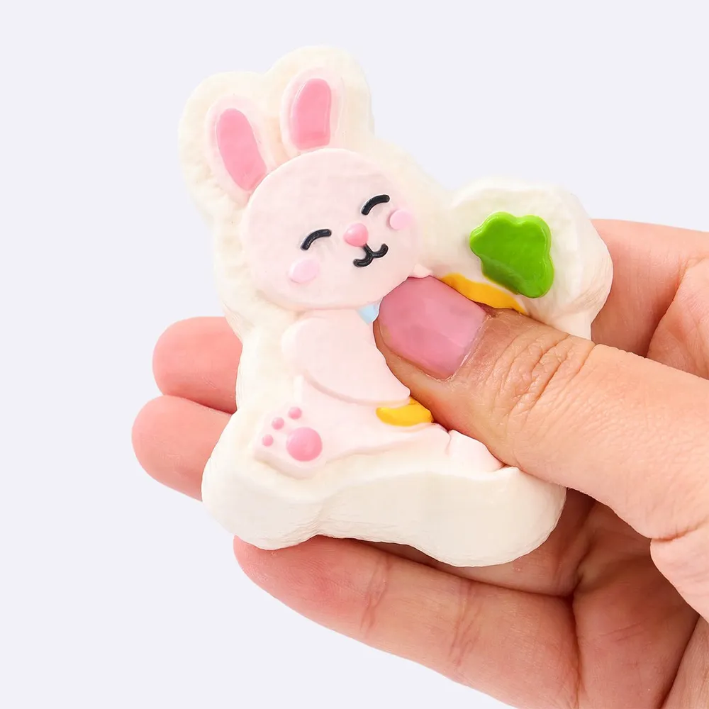 Pink Rabbit Holding Carrot — photo 3