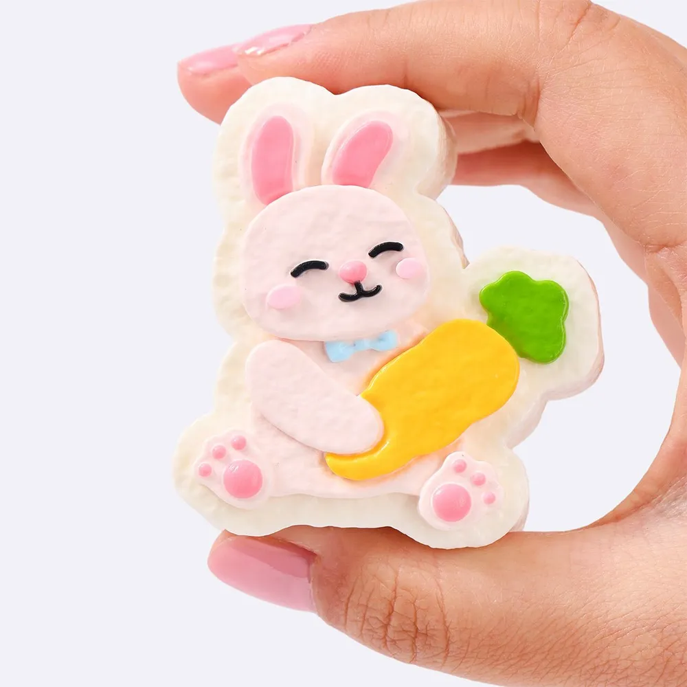 Pink Rabbit Holding Carrot — photo 4